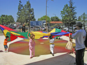 Children playing with parachute